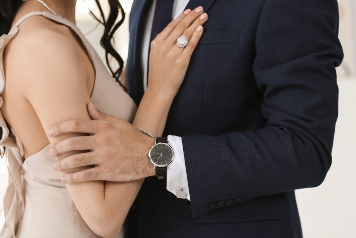 Young couple wearing stylish accessories indoors
