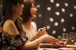 The ladies laughing happily at the bar